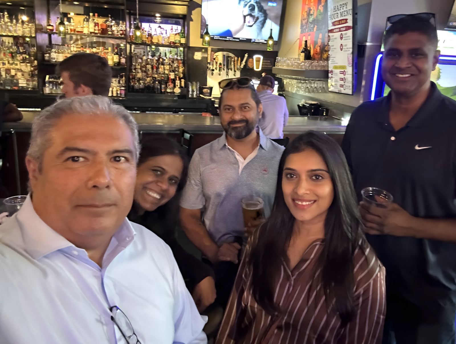 Attendees gathered at the bar at a Mind & Machine DFW event
